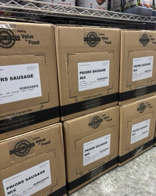 Boxes of Priors Sausage Mix stacked on shelving